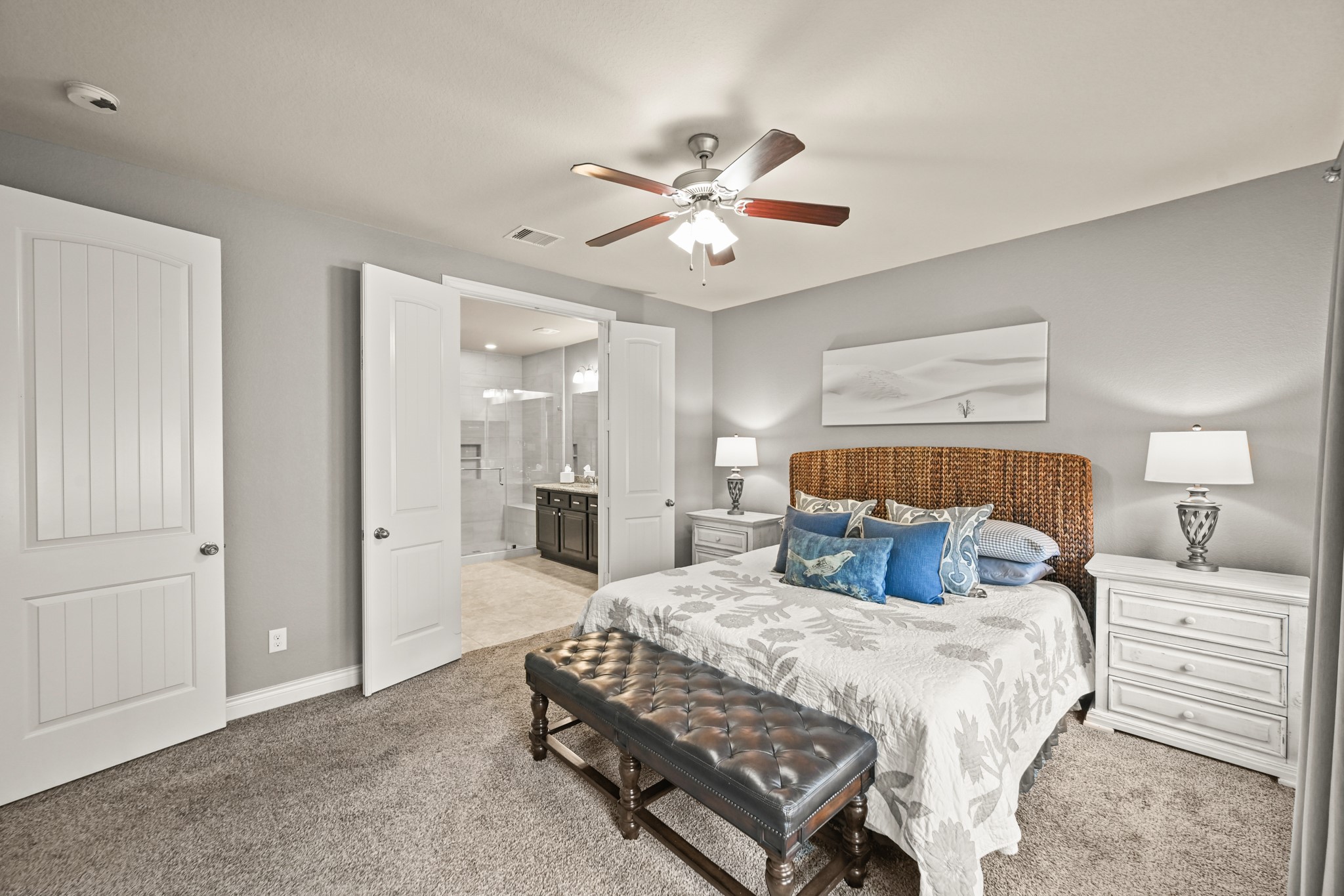 24214 Calico Trace Lane Katy, TX 77494 - Photo 7 of 49 a bedroom with a bed and a chandelier