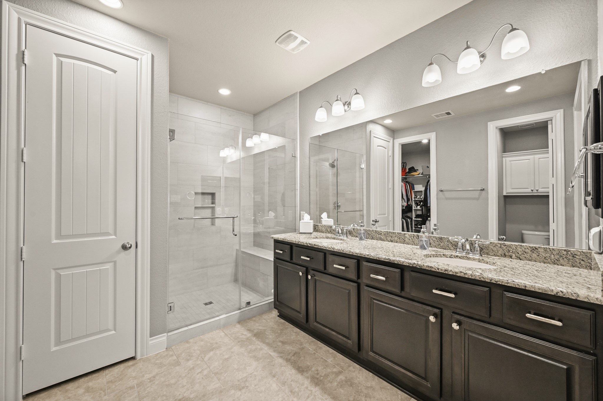 24214 Calico Trace Lane Katy, TX 77494 - Photo 8 of 49 a spacious bathroom with a double vanity sink mirror and double