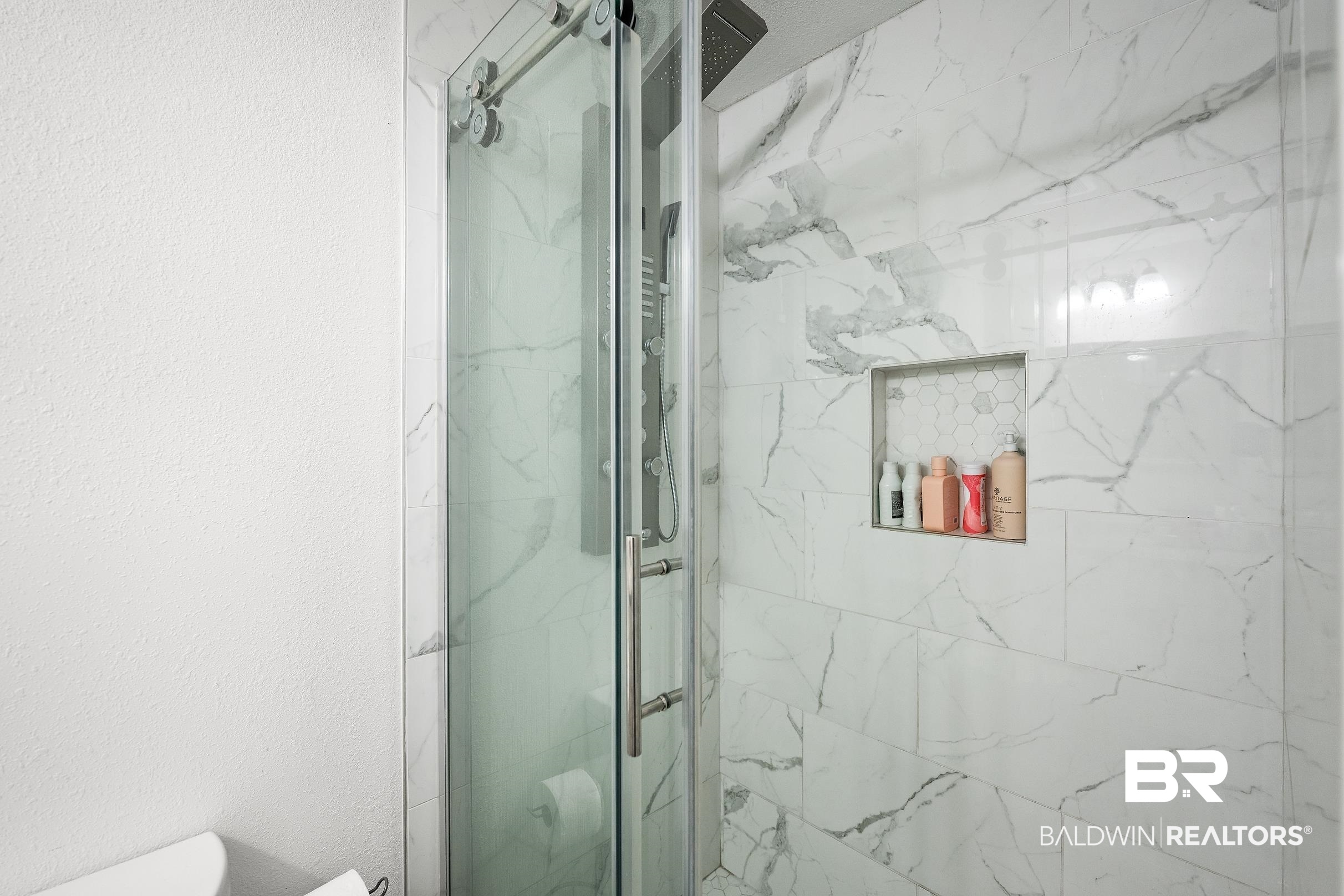33129 Antietam Road Lillian, AL 36549 - Photo 16 of 31 Frameless glass shower enclosure with sliding door and stainless steel hardware