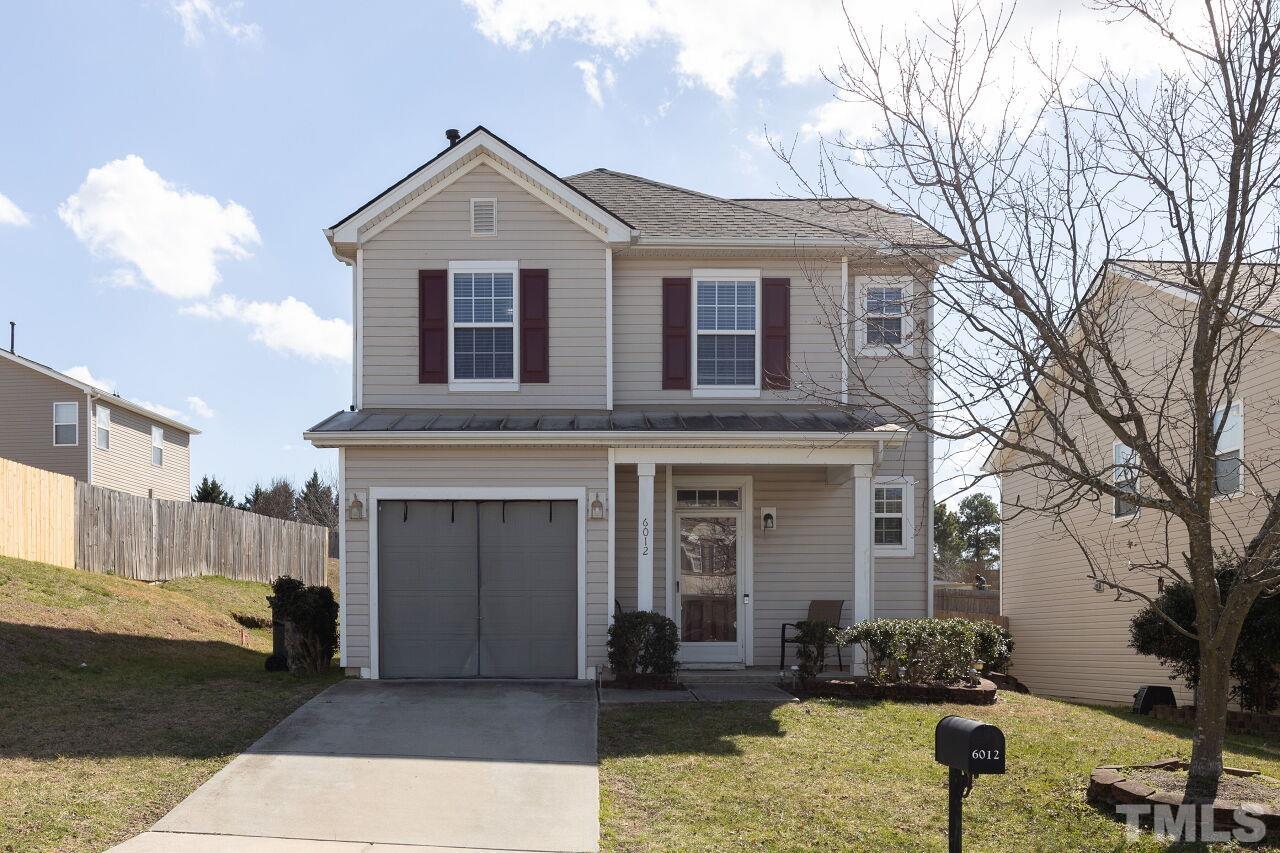6012 Ladish Lane Raleigh, NC 27610 - Photo 1 of 29 a front view of a house with a yard