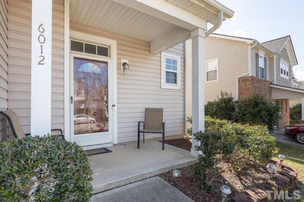 6012 Ladish Lane Raleigh, NC 27610 - Photo 2 of 29 a view of house with backyard and a garden
