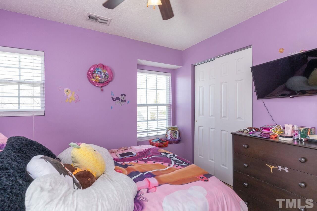 6012 Ladish Lane Raleigh, NC 27610 - Photo 22 of 29 a bedroom with a bed and a window