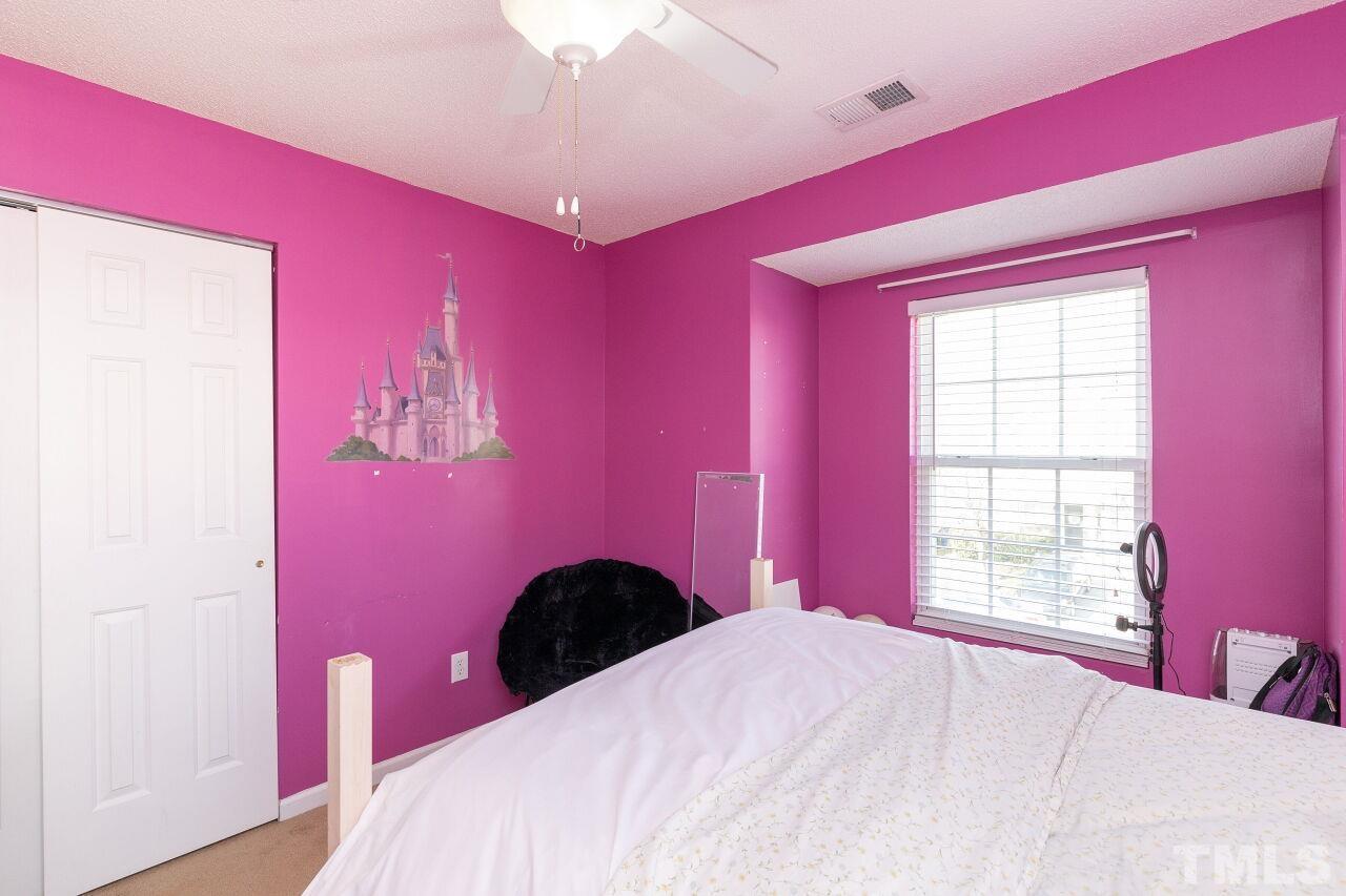 6012 Ladish Lane Raleigh, NC 27610 - Photo 25 of 29 a bedroom with a bed and a window