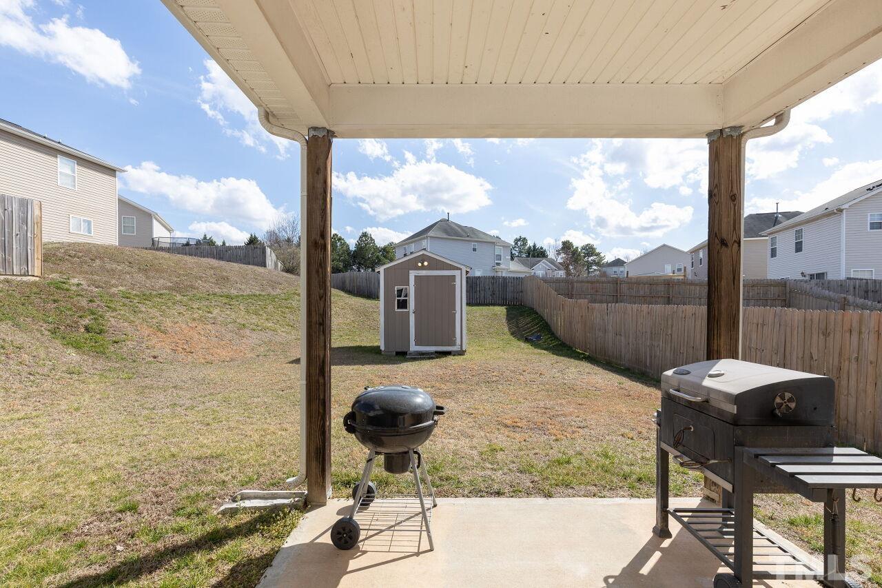 6012 Ladish Lane Raleigh, NC 27610 - Photo 26 of 29 a balcony view with a couple of chairs and a table