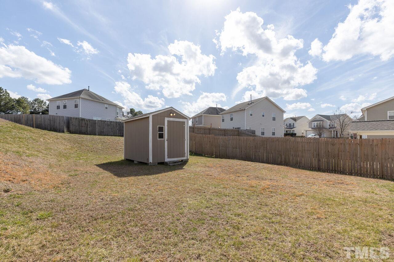 6012 Ladish Lane Raleigh, NC 27610 - Photo 28 of 29 a front view of a house with a yard