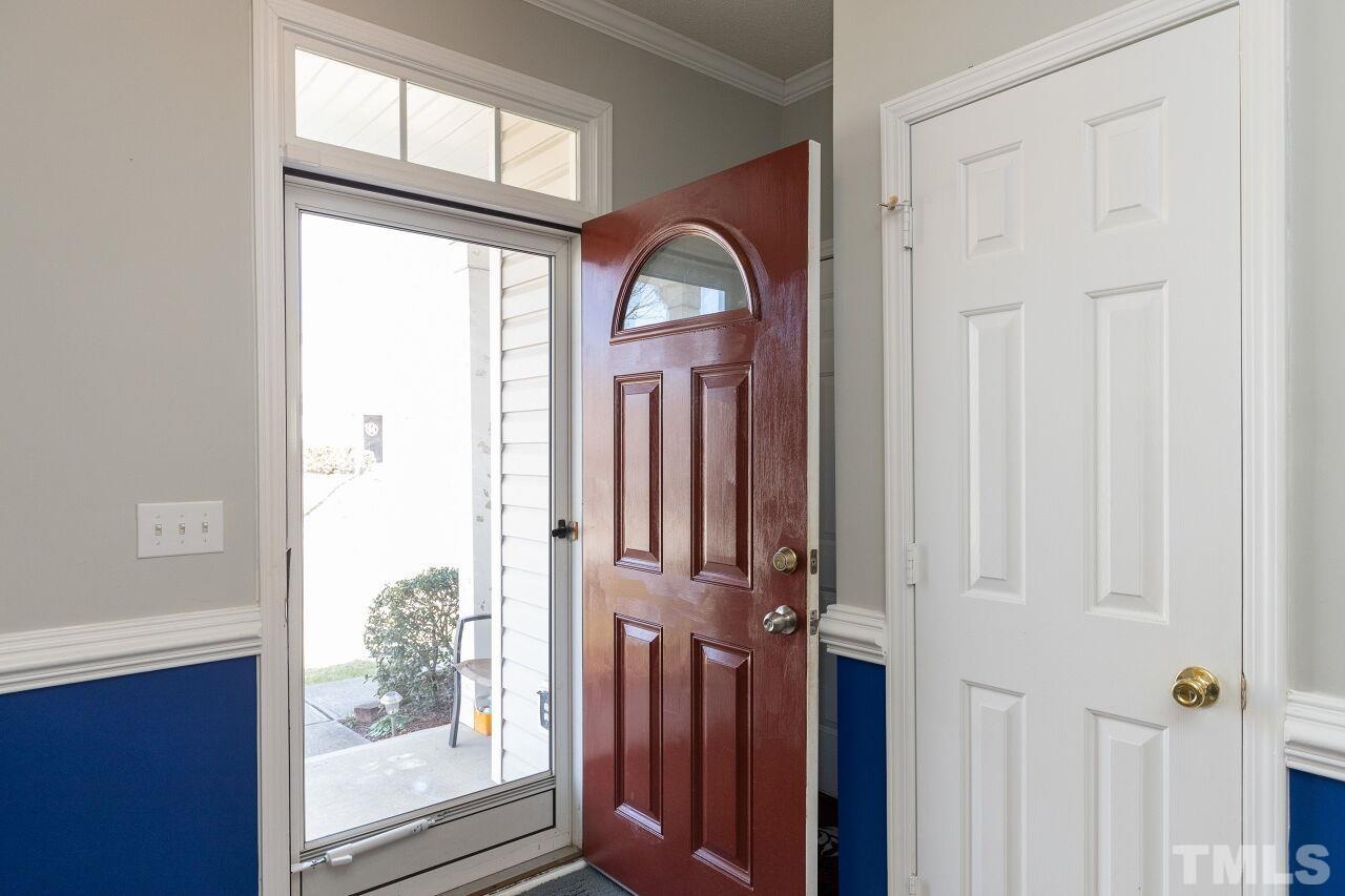 6012 Ladish Lane Raleigh, NC 27610 - Photo 3 of 29 a view of a wooden door with a glass door