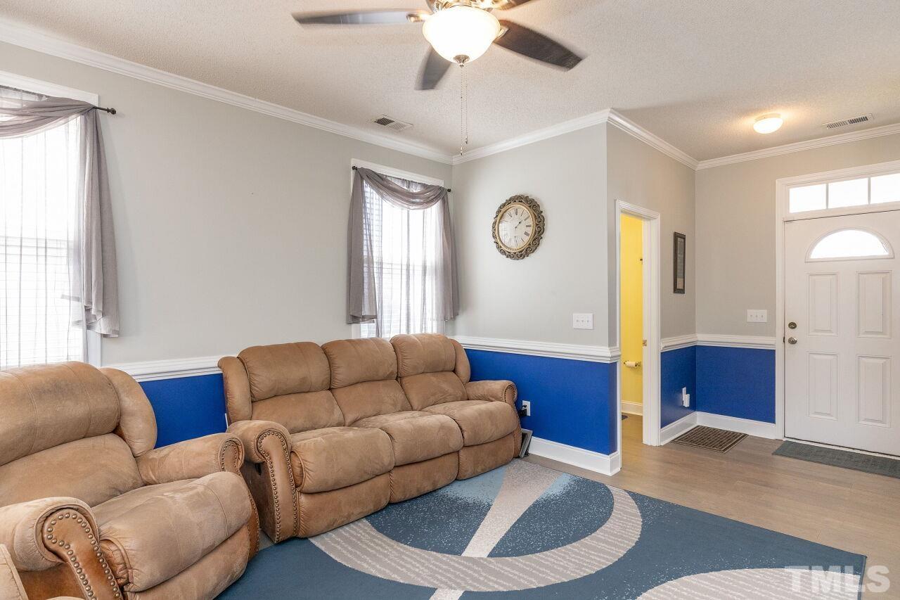 6012 Ladish Lane Raleigh, NC 27610 - Photo 6 of 29 a living room with furniture and a large window