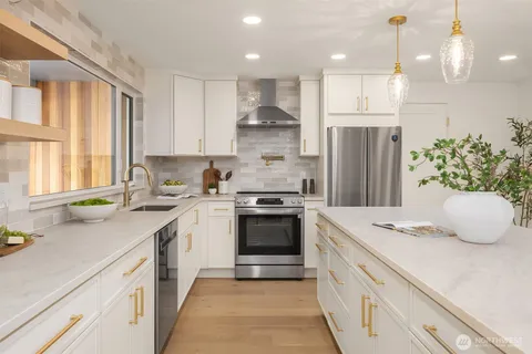 a kitchen with a sink stove and refrigerator