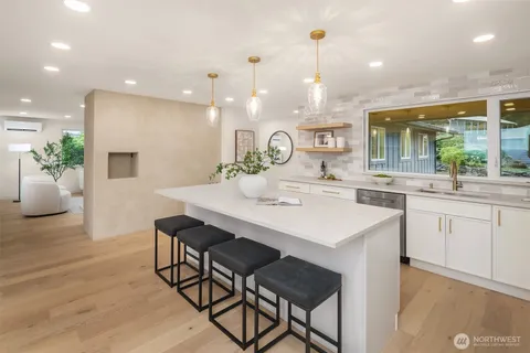 a kitchen with a table and chairs in it
