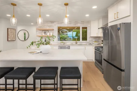 a kitchen with a table and chairs in it