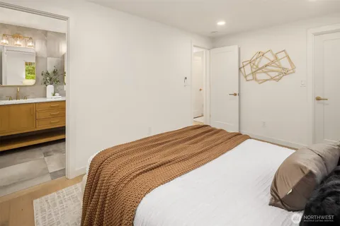 a bedroom with a bed and a dresser