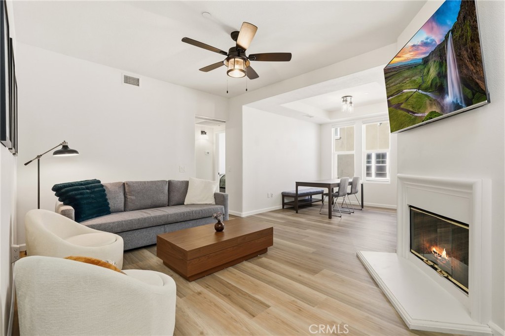 52 Valmont Way Ladera Ranch, CA 92694 - Photo 4 of 29 a living room with furniture and a fireplace