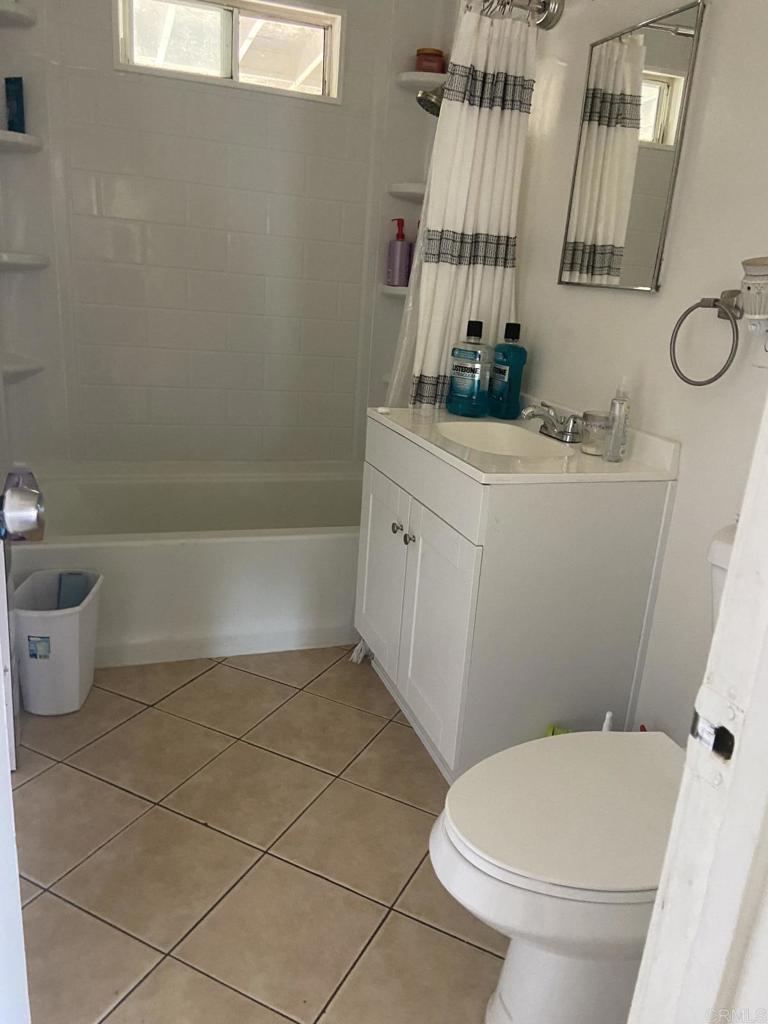 917 Broadview Street Spring Valley, CA 91977 - Photo 11 of 14 a bathroom with a sink a toilet and shower