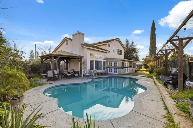 a view of a house with swimming pool