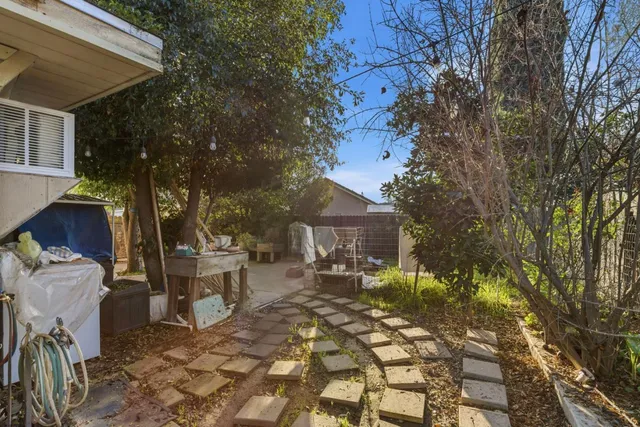 a view of a patio with chair and tables