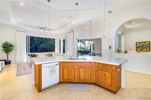 a kitchen with a stove a refrigerator and a sink
