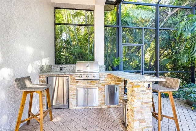 a view of kitchen with furniture and garden view