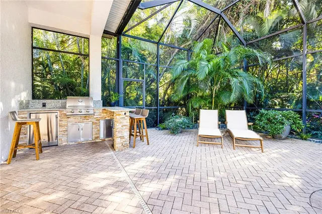 a view of a swimming pool with a lounge chair