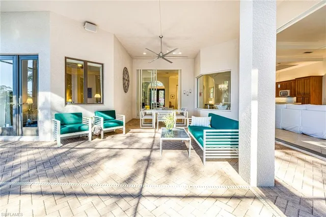 a view of a room with wooden floor and furniture