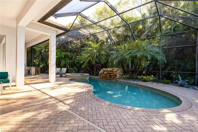 a view of a swimming pool with a patio