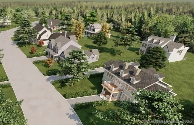 an aerial view of a house with yard and outdoor seating