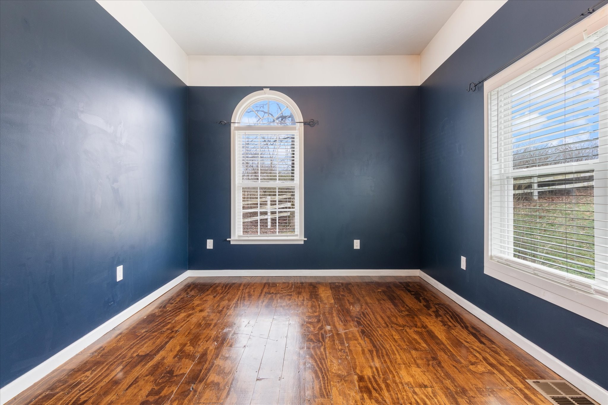 471 Northup Road Portland, TN 37148 - Photo 15 of 38 an empty room with wooden floor and windows