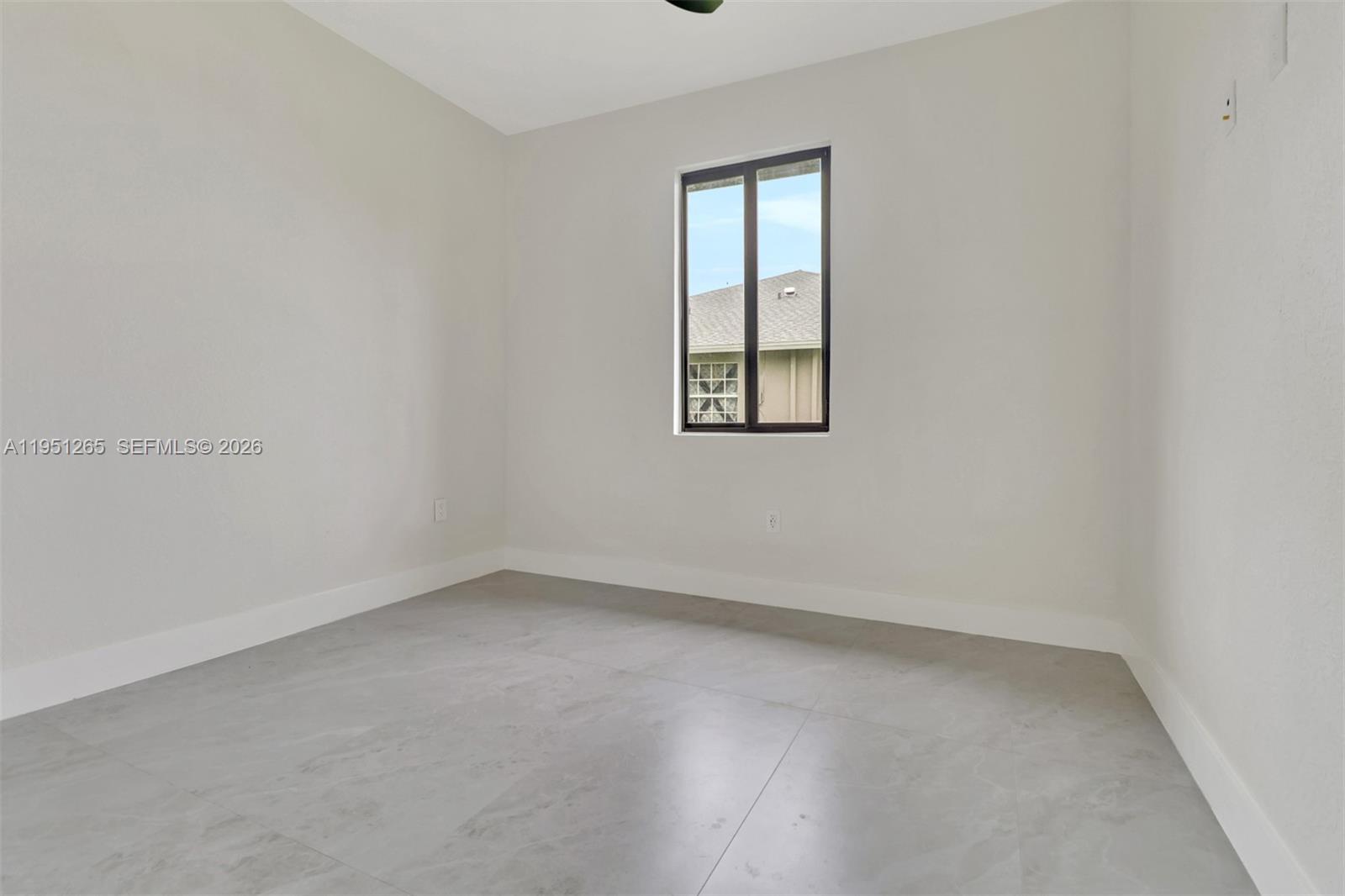 4501 15th Street Southwest, Unit 4501 Lehigh Acres, FL 33973 - Photo 13 of 40 an empty room with a window
