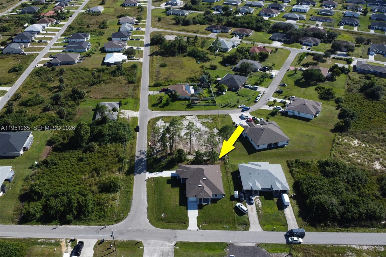 4501 15th Street Southwest, Unit 4501 Lehigh Acres, FL 33973 - Photo 21 of 40 an aerial view of houses with yard