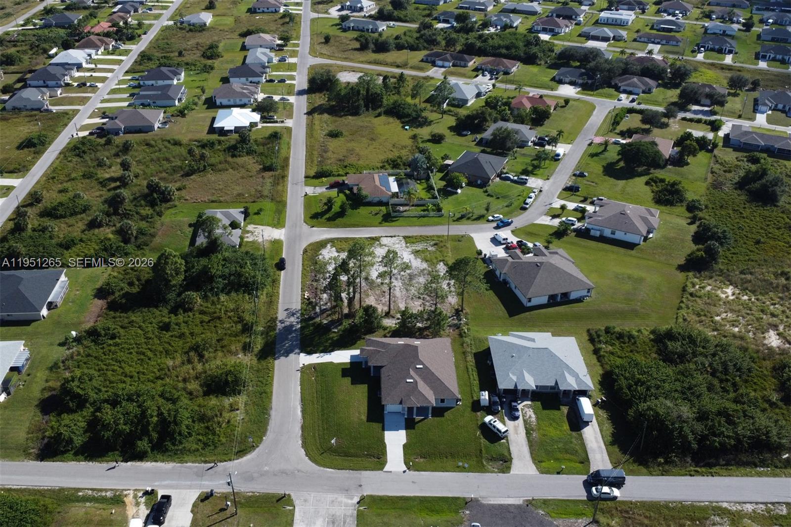 4501 15th Street Southwest, Unit 4501 Lehigh Acres, FL 33973 - Photo 23 of 40 an aerial view of houses with yard