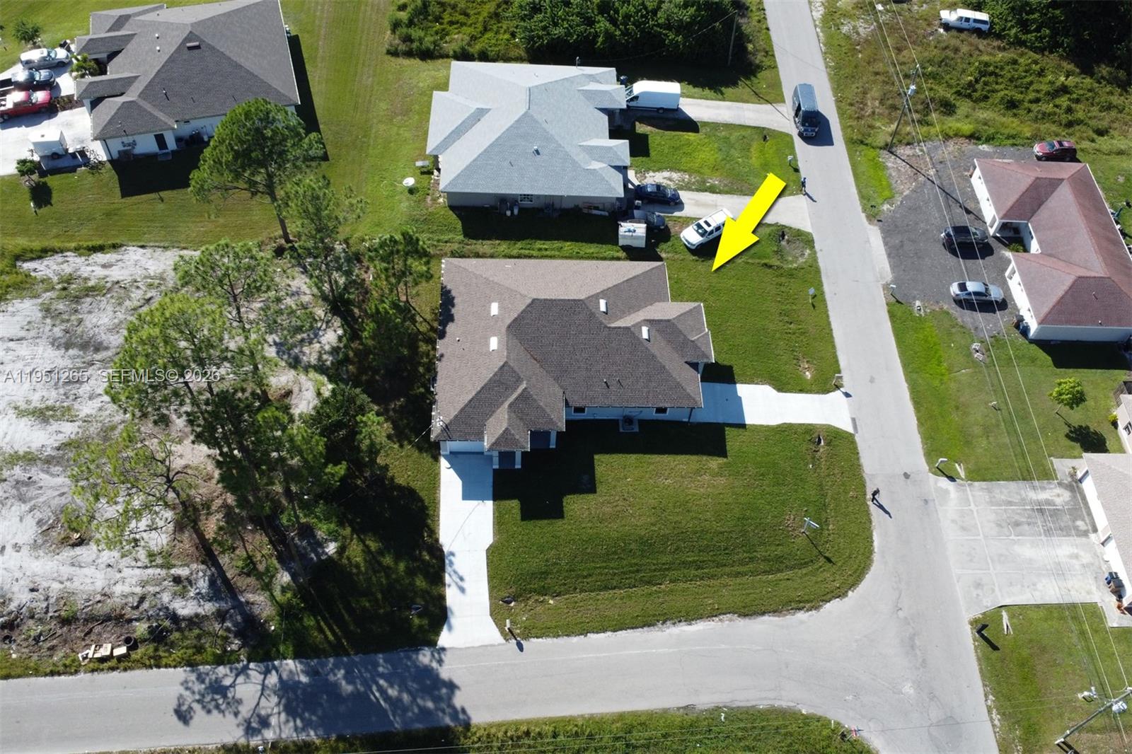 4501 15th Street Southwest, Unit 4501 Lehigh Acres, FL 33973 - Photo 26 of 40 an aerial view of a house with a garden