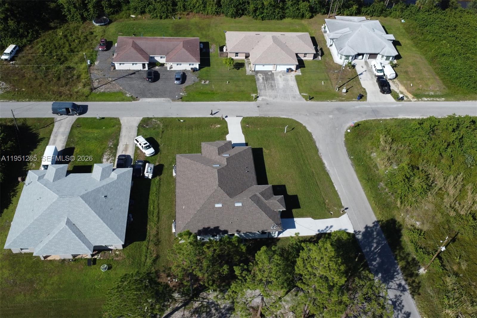 4501 15th Street Southwest, Unit 4501 Lehigh Acres, FL 33973 - Photo 27 of 40 an aerial view of a house with garden space and street view