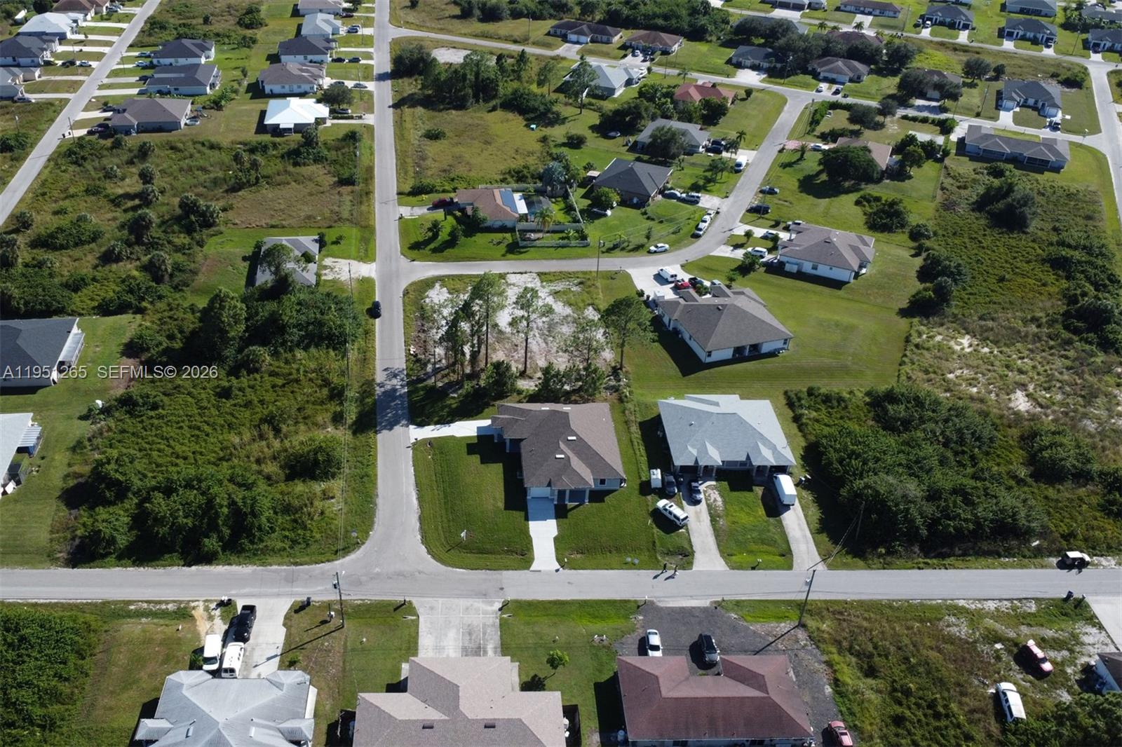 4501 15th Street Southwest, Unit 4501 Lehigh Acres, FL 33973 - Photo 28 of 40 an aerial view of houses with yard