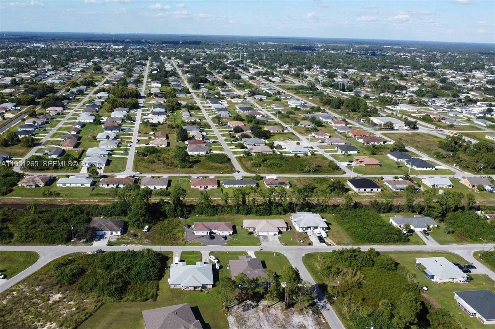 4501 15th Street Southwest, Unit 4501 Lehigh Acres, FL 33973 - Photo 32 of 40 an aerial view of a city