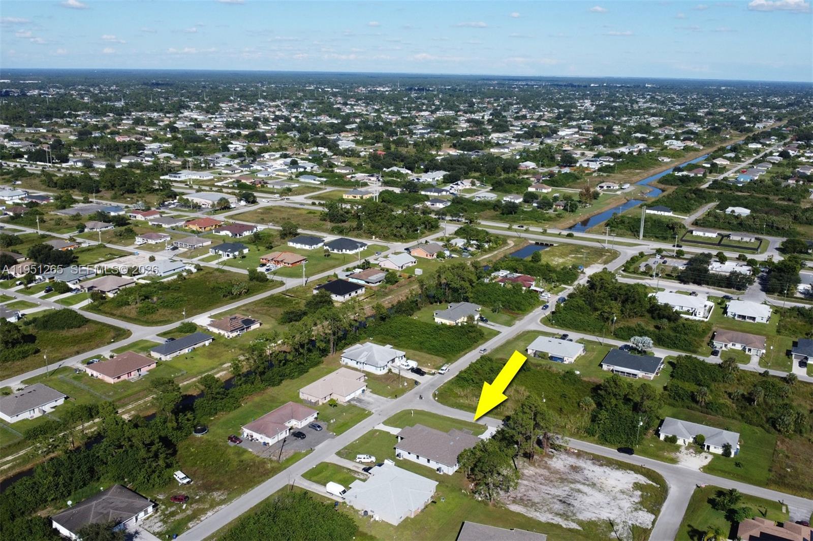 4501 15th Street Southwest, Unit 4501 Lehigh Acres, FL 33973 - Photo 33 of 40 an aerial view of residential houses with outdoor space
