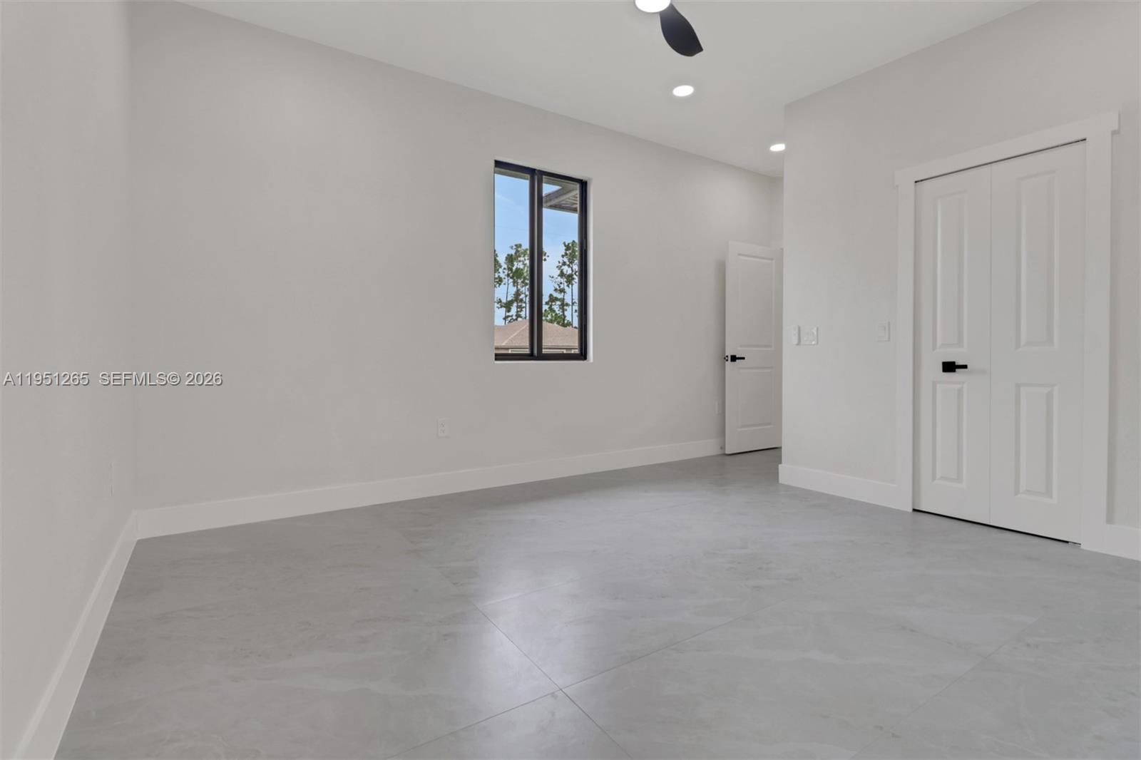 4501 15th Street Southwest, Unit 4501 Lehigh Acres, FL 33973 - Photo 10 of 40 an empty room with a empty space and windows