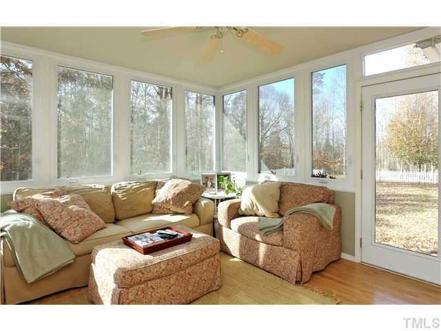 3106 Gold Digger Road Clayton, NC 27520 - Photo 6 of 22 Bright SunRoom overlooks wooded acreage. Not included in heated square footage!