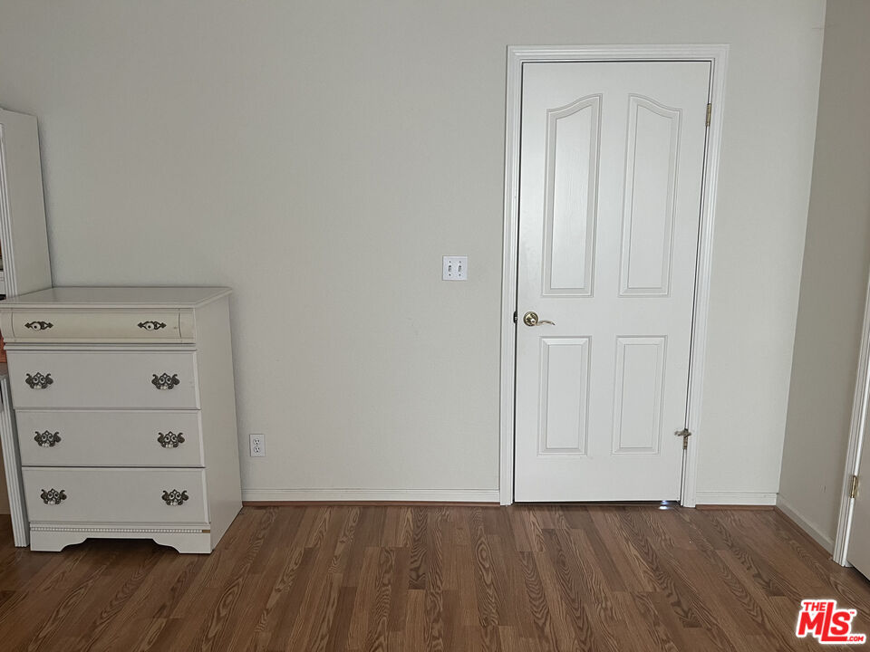 2308 Walnut Grove Avenue San Jose, CA 95128 - Photo 2 of 5 an empty room with wooden floor and closet