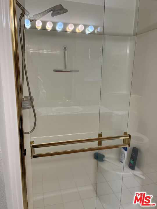 2308 Walnut Grove Avenue San Jose, CA 95128 - Photo 3 of 5 a bathroom with a shower and a mirror