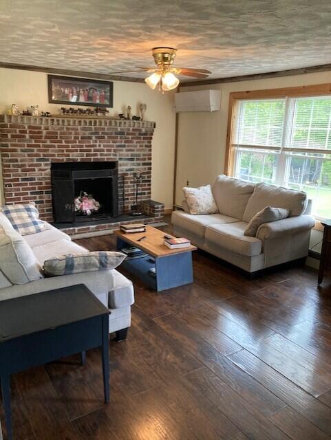 541 Highway 150 Parkman, ME 04443 - Photo 15 of 31 Living room and working fireplace