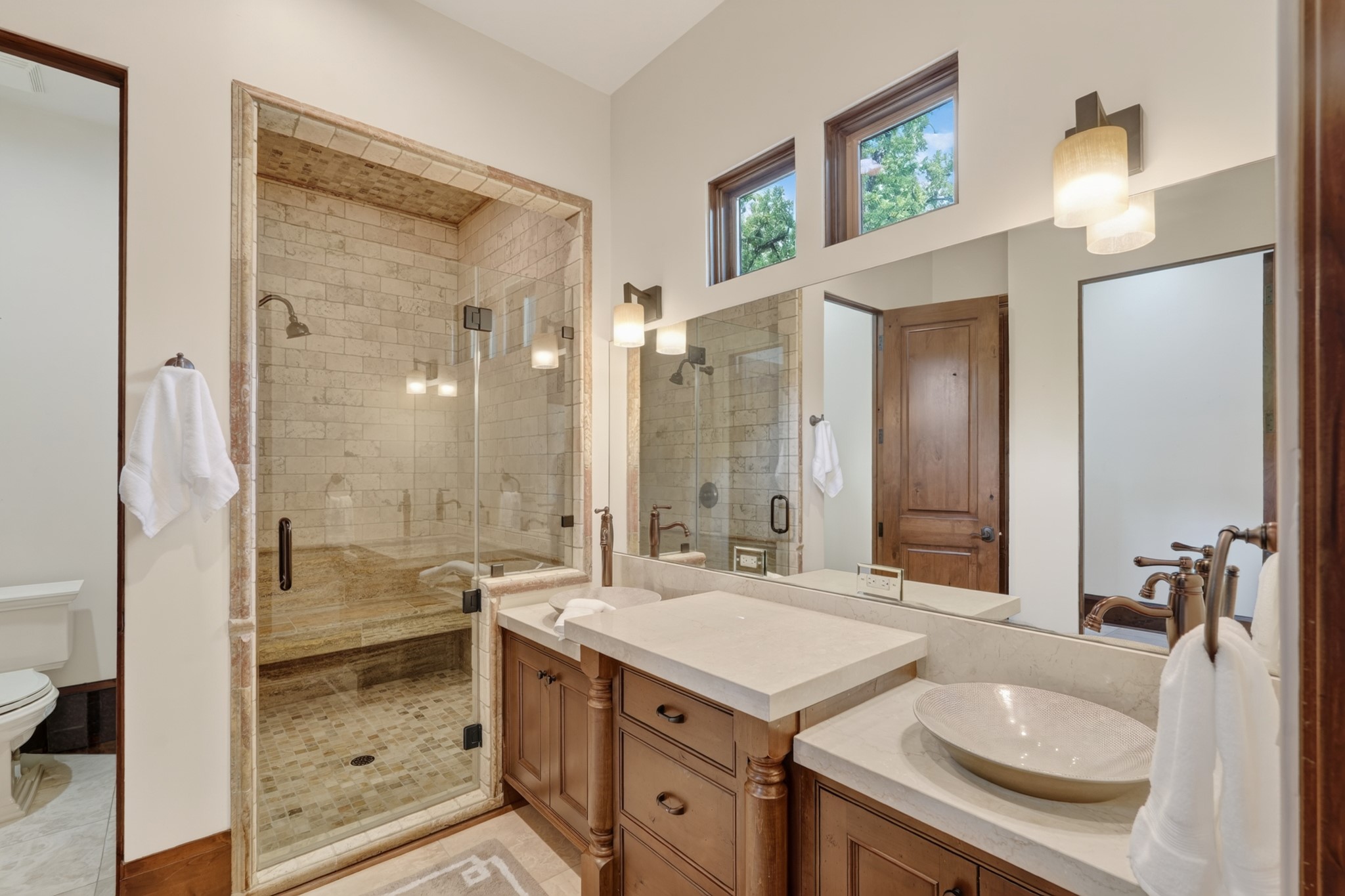 247 South Fazio Way Spring, TX 77389 - Photo 36 of 50 a spacious bathroom with a granite countertop sink mirror and a shower
