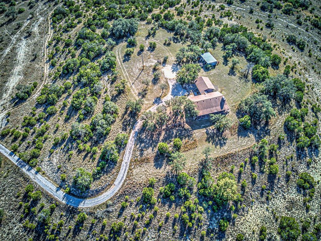 414 Hall Lane Spicewood, TX 78669 - Photo 1 of 16 an aerial view of residential house with outdoor space and trees all around
