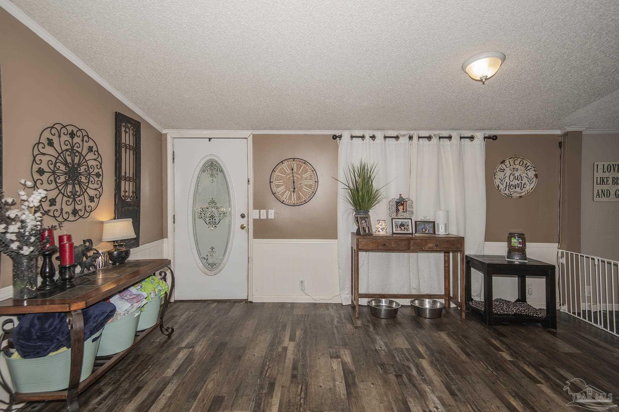 6739 Deception Road Milton, FL 32583 - Photo 11 of 24 a living room with furniture and wooden floor