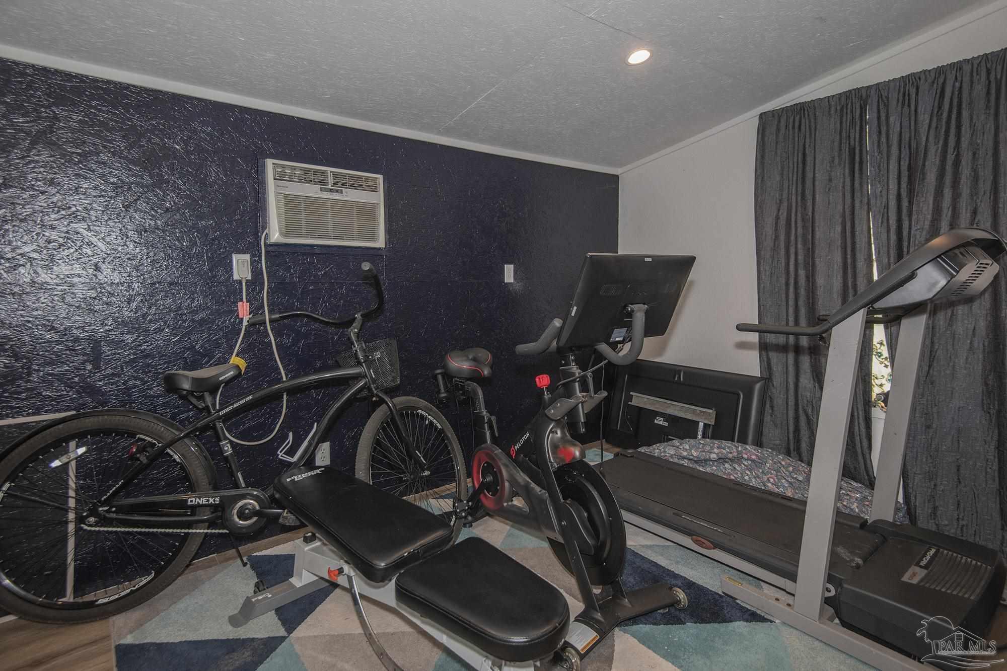 6739 Deception Road Milton, FL 32583 - Photo 14 of 24 a view of a room with gym equipment
