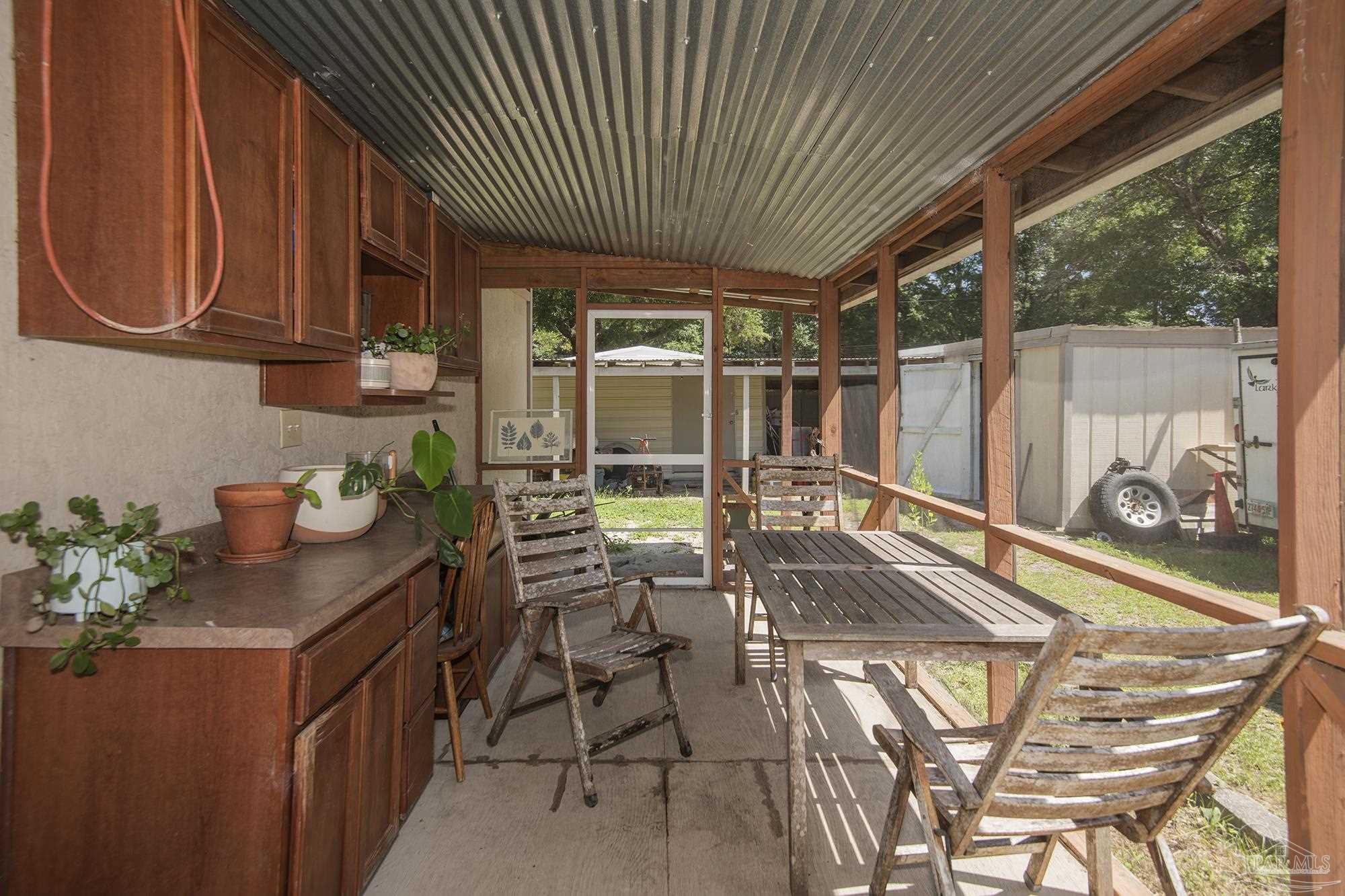 6739 Deception Road Milton, FL 32583 - Photo 22 of 24 a kitchen with a sink and cabinets