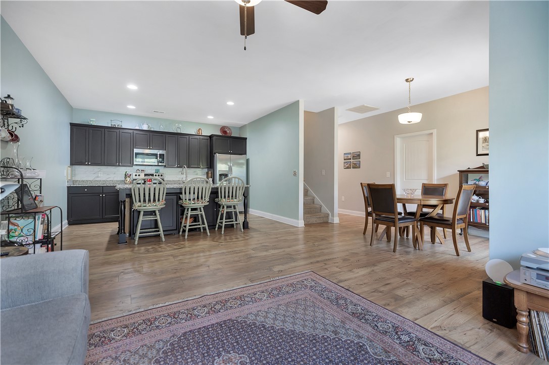 121 Ventura Street Anderson, SC 29621 - Photo 30 of 32 An open floorplan seamlessly connects the kitchen with a dining area, featuring recessed lighting throughout.