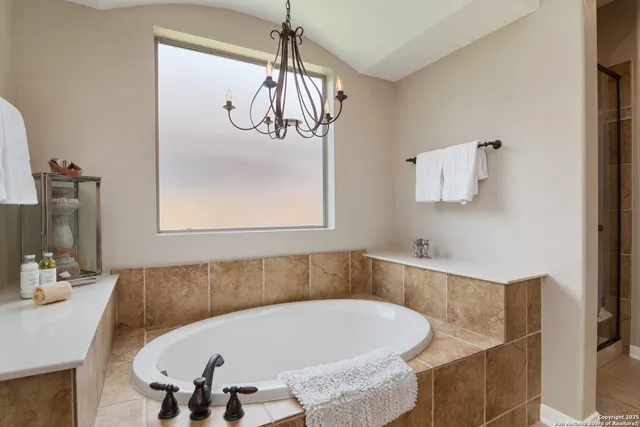 a bath tub sitting in a bathroom next to a sink