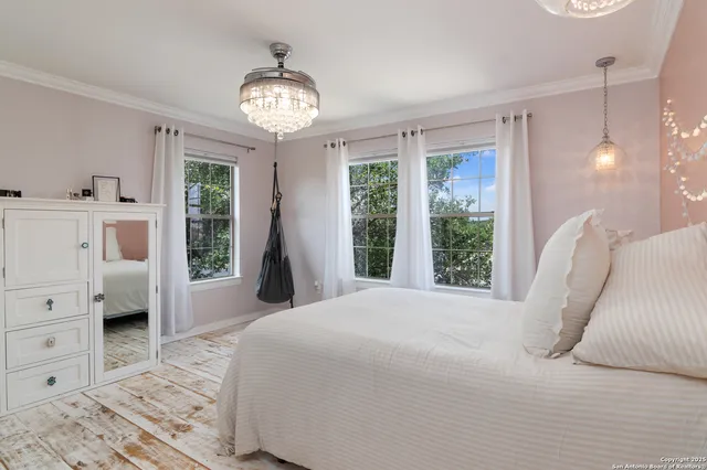 a spacious bedroom with a large bed and a window