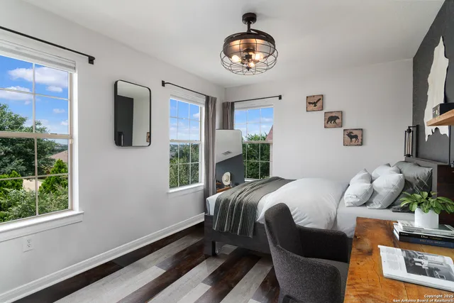 a bed room with a bed and a chandelier