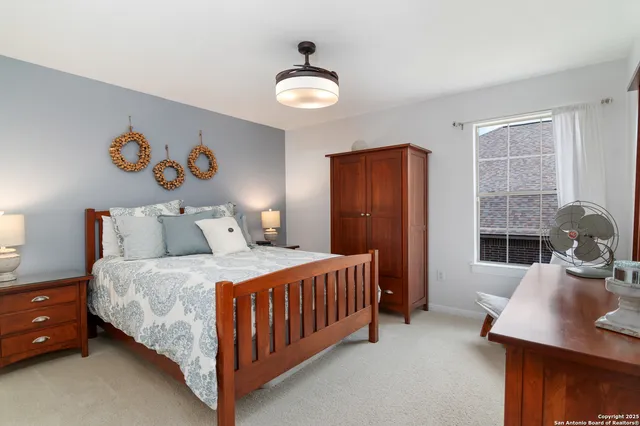 a bedroom with a bed and a table