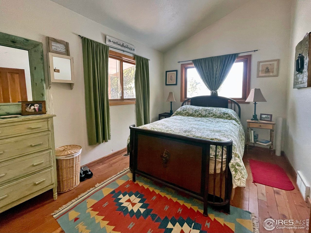 44 Riverside Lane Ward, CO 80481 - Photo 15 of 33 a bed room with a bed and a window